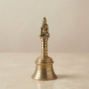 Cloche de prière avec tête de Bouddha